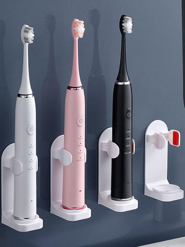 Pakistani family using rechargeable electric toothbrush for teeth whitening and oral hygiene