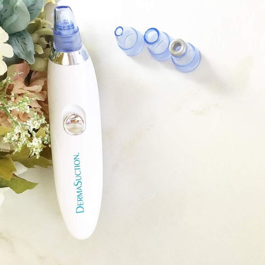 Battery operated derma suction device showing 4 suction heads for blackhead removal Pakistan